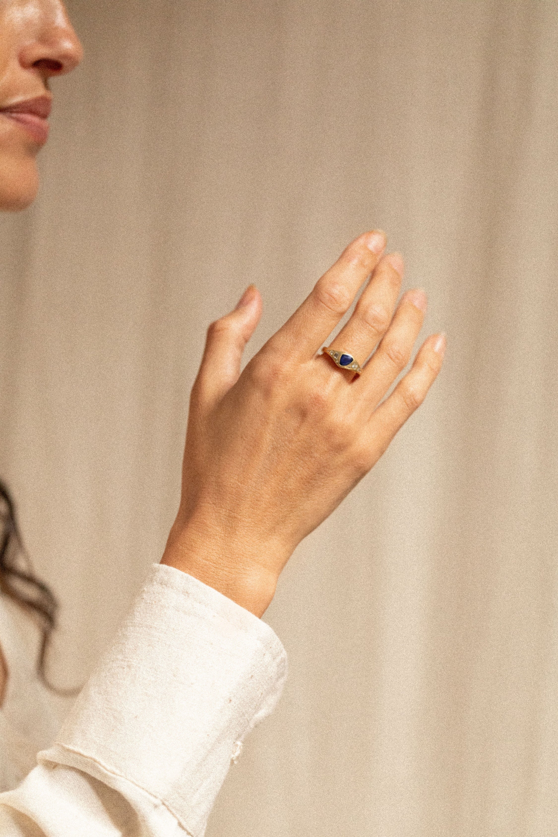 18K gold Astra ring with blue sapphire and diamonds worn— handcrafted diamond ring — artisan fine jewelry — Sun Rae