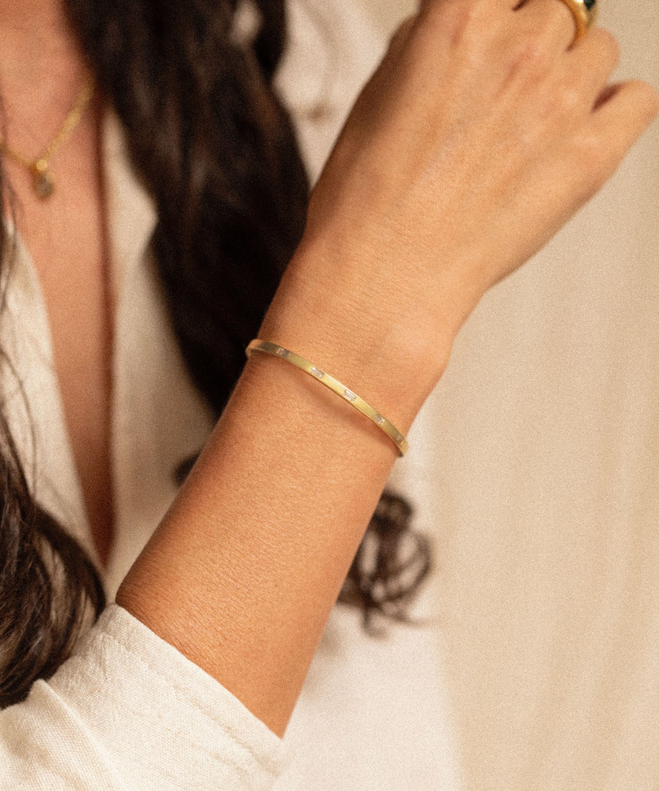 18K gold eternity cuff worn on wrist — White Sapphires- artisan handcrafted fine jewelry — Sun Rae
