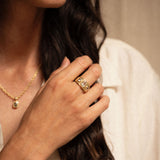 18K gold eternity ring worn on finger — artisan handcrafted jewelry — Sun Rae
