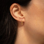 18K gold Surya huggies worn — artisan handcrafted gold earrings — Sun Rae