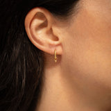 18K gold Surya huggies worn — artisan handcrafted gold earrings — Sun Rae