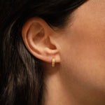 18K gold Trinity huggies worn — artisan handcrafted gold earrings — Sun Rae
